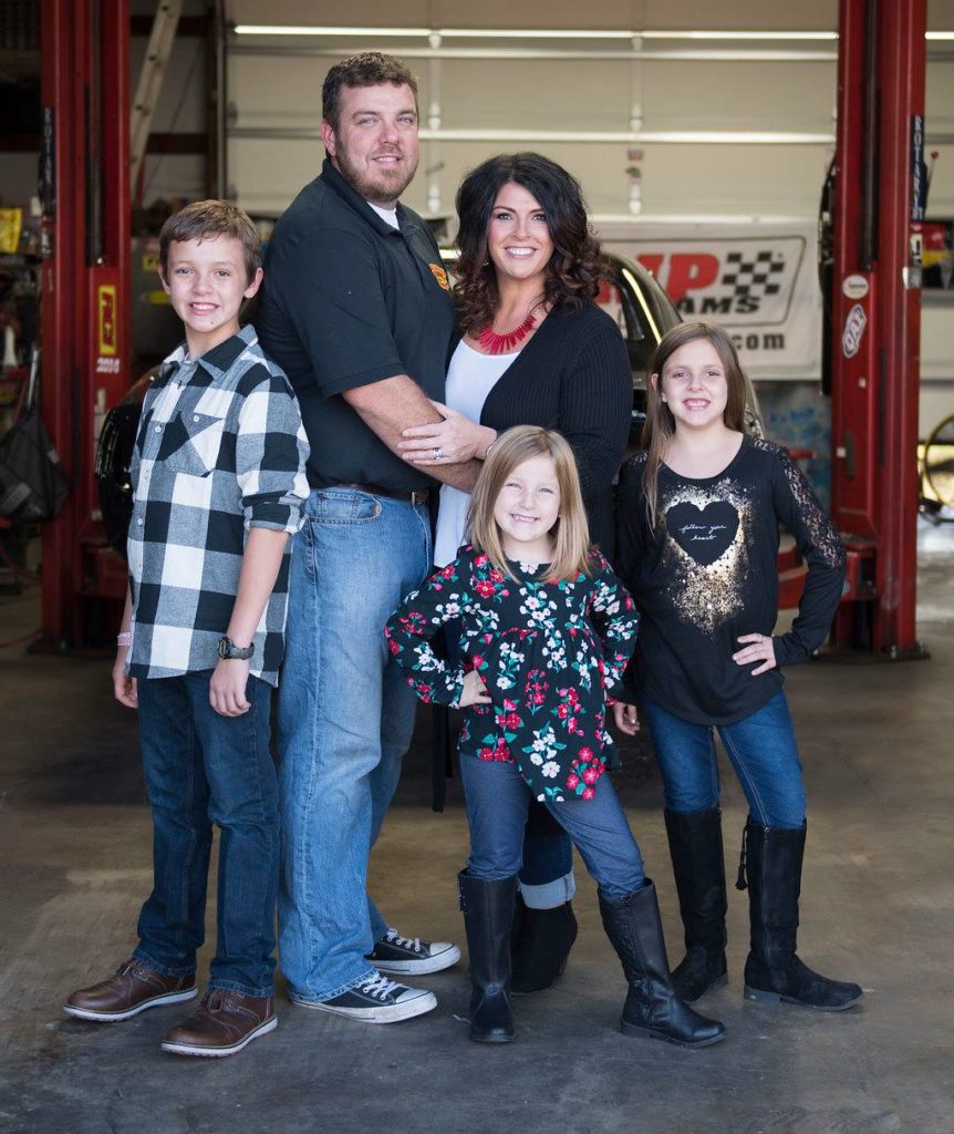 Morris family posing in shop